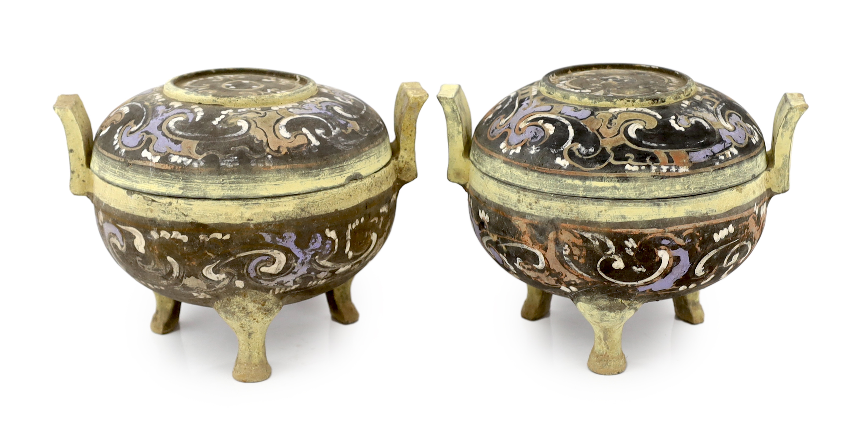 A pair of Chinese polychrome pottery ritual tripod vessels and covers, ding, Han dynasty (202BC - 220AD)